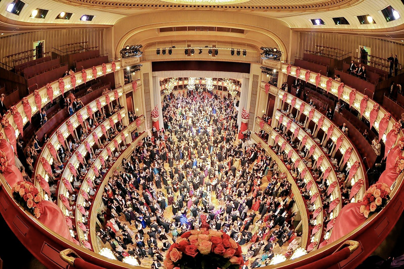 Photo of the opera hall taken from above, showcasing multiple stories with seats.